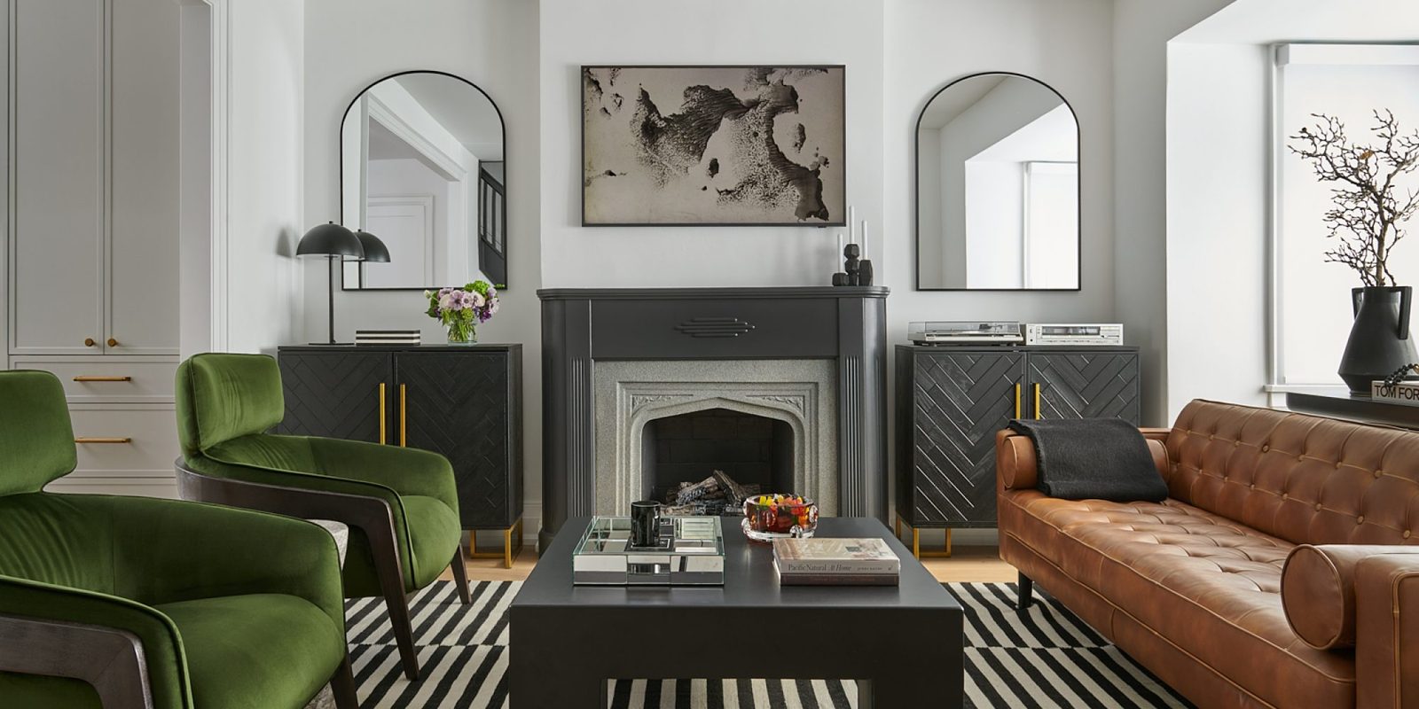 Moore Park renovation living room with fireplace and green velvet chairs