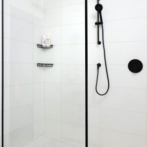 Toronto white tile Bathroom wiht black shower head