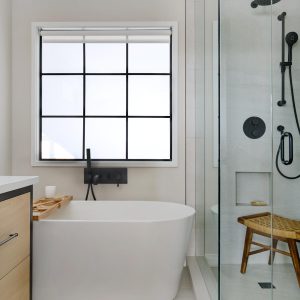 Stand up shower and bath tub at Boardwalk The Beaches - By Urban Blueprint